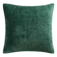 a green velvet pillow on a white background