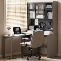 a chair sitting in front of a desk with a laptop on it