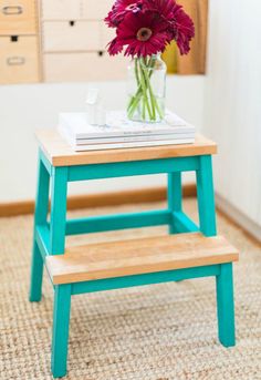 an image of a wooden step stool with flowers on top and the words gung ho above it