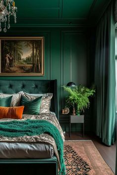 a bedroom with green walls and a large painting on the wall above the headboard