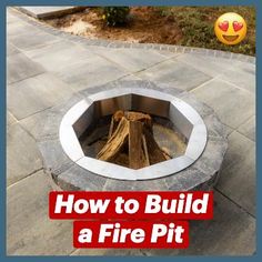 an outdoor fire pit made out of bricks and concrete with a smiley face in the background