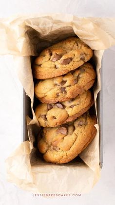 chocolate chip cookies in a paper bag on top of a white surface with text overlay