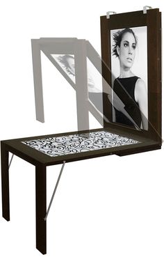 a table with a mirror on it and a woman's face in the reflection