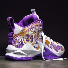 a pair of shoes with purple and white designs on the upper part of the shoe