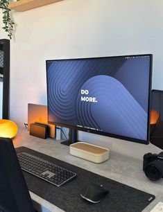 a computer monitor sitting on top of a desk