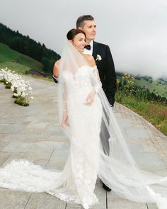 a bride and groom posing for a wedding photo