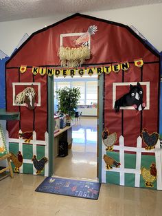 a red barn decorated with farm animals and decorations