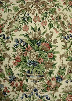 an old wallpaper with many flowers and leaves on the side, in various colors