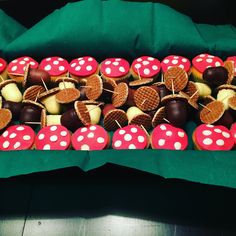 a tray filled with lots of different types of cookies and waffles on top of each other