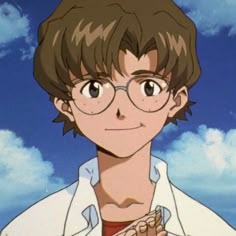 a young man with glasses and a white shirt is standing in front of some clouds