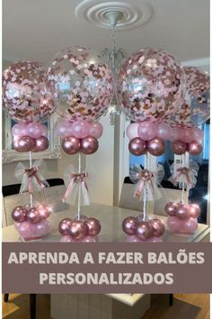 some pink and white balloons on a table