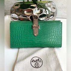 Up For Your Consideration Authentic Hermes Bearn Wallet Crocodile Lizard Skin Green / Ombre Color Phw. It Is In Excellent Condition With Very Minor Signs Of Wear: Exterior Is Flawless And Does Not Have Any Scratches Or Scuffs, No Corner Wear, No Glazing Issues. The H-Closure Has Minor Hairline Scratches On It, Nothing Major Though. Very Clean Inside And Does Not Have Any Issues! Overall Condition Is 9.5/10. Comes With Spare Dustbag. Please Message Me With Any Additional Questions! Alligator Wallet, Lizard Skin, Green Ombre, Ombre Color, Hermes Bags, Alligator, Dust Bag, Bag Lady, Exterior