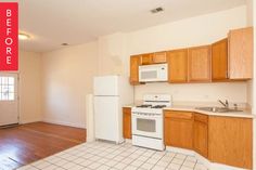 an empty kitchen with wooden cabinets and white appliances in it's new home, before and after remodeling