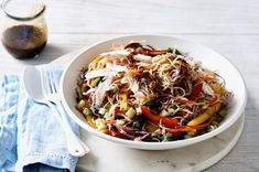 a white bowl filled with coleslaw and vegetables