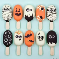 there are many pops decorated to look like halloween