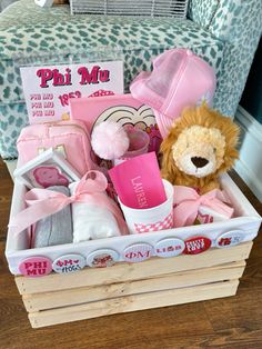 a basket filled with pink items on top of a wooden crate