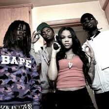 three young men standing next to each other in front of a mirror with the word bape on it