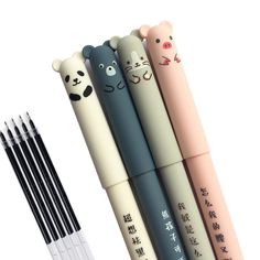 four different colored pens with cartoon animals on them