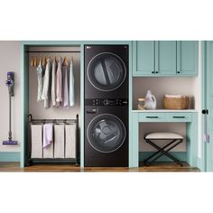 a washer and dryer in a laundry room with blue cabinets on the wall