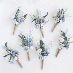 six blue and white flowers are arranged on top of each other in the shape of an arrow