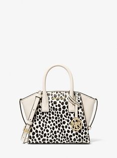 Equally versatile and sophisticated, our Avril satchel is a must-have addition to your handbag lineup. Crafted from printed calf hair and leather, this gusseted design opens to a pocketed interior and features a detachable crossbody strap for versatility of wear. It’s the perfect complement to office-ready looks and casual weekend wear alike. Cheetah Print Hair, Cheetah Purse, Small Cow, Michael Kors Satchel, Hair Trim, Black Satchel, Michael Kors Outlet, Leather Satchel Bag, Michael Kors Collection