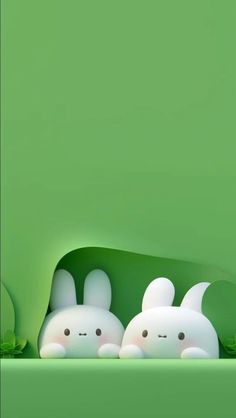 three little white rabbits in a green room