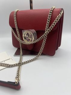 Gucci GG Dollar Calf Red Interlocking Chain Handbag Leather Bag Italy 510304. Gucci Gucci GG Dollar Calf Red Interlocking Chain Handbag Leather Bag Made in Italy NEW Dustbag Shoulder Bag Italy Authentic New New with Tags. Made in Italy. ONLY 1 in stock Red bags are so very in this season!!! Approx Base Length: 7.5” Height: 5.5” Width: 3.5” Shoulder Drop: 11” and 22.25” Can be worn as a shoulder bag or a crossbody. Dollar Calfskin Medium Interlocking G Shoulder Bag A Gucci handbag can be instantly-recognized anywhere, any time. Thanks to the brand’s pioneering Creative Director, the Florentine fashion house has become one of the world’s most influential names. This red leather GG ring shoulder bag from Gucci features gold-tone hardware, an adjustable shoulder strap, a hanging Double G ring Gucci Bags Handbags, G Ring, Gucci Handbag, Chain Handbag, Gucci Gucci, Gucci Handbags, Gucci Bags, Fashion House, Creative Director