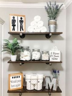 bathroom shelves decorated with toiletries and other items for decor on top of each shelf