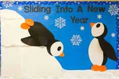 a penguin and penguinling are depicted on a bulletin board with snowflakes in the background