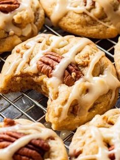 pecan cookies with icing and pecans on a cooling rack, ready to be eaten