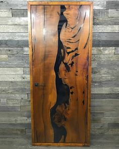 a wooden door with a painting on it