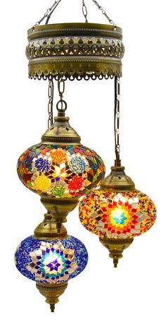 an ornate chandelier with four different colored lamps hanging from it's sides