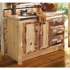 an old fashioned wooden sink cabinet in a room with wood flooring and furniture on display