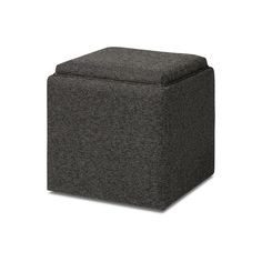 a small square ottoman with a black fabric cover