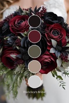 a bridal bouquet with red roses, black and white flowers and greenery is the focal point for this photo