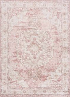 a pink and beige rug with an ornate design on the center, in front of a white background