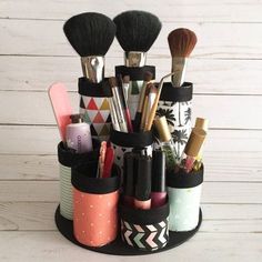 an organized makeup brush holder on a white wooden background