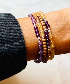 These bracelets are made with genuine, polished, citrine and amethyst gemstones (4.5 mm), Sandalwood beads (4mm),  Karen Hill tribe silver  nugget beads (3.5mm), and Sterling silver donut beads (3mm).  💎 CITRINE GEMSTONE INFO Known as "the sunshine stone", Citrine energises every level of life.  It cleanses the chakras and opens the intuition.   Citrine attracts wealth, prosperity and success.    It raises self-esteem and strengthens the intellect.   Citrine promotes motivation, activates creat Citrine Bracelet, Hill Tribe Silver, Amethyst Bracelet, Citrine Gemstone, Amethyst Gemstone, Bracelet Stack, Bracelet Designs, Citrine, Jewelry Bracelets