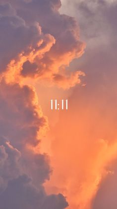 an orange and pink sky with the words 11 11 above it