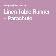 the linen table runner parachute is shown in white on a purple background with text that reads