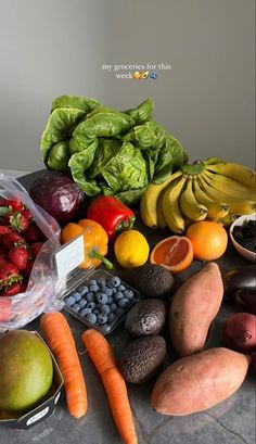 a table topped with lots of fruits and vegetables