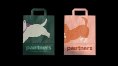 two paper bags with dogs on them, one is green and the other is orange