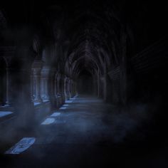 an image of a dark hallway with light coming from the ceiling and fog in the air