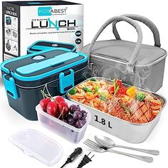 the lunch box is filled with food and has utensils next to it,