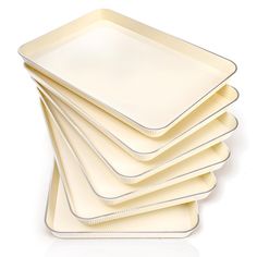 six white plates stacked on top of each other