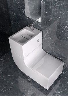 a white toilet sitting in a bathroom next to a mirror