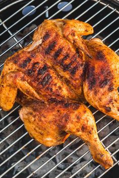 grilled chicken sitting on top of a black grill