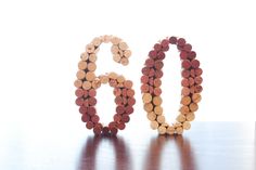 the number 50 made out of wine corks on a table with a white background