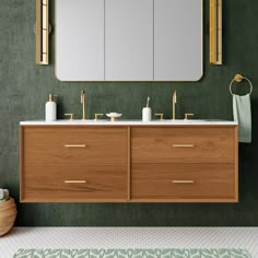 a bathroom vanity with two sinks and mirrors on the wall, along with a rug