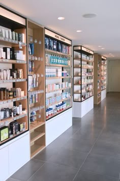 an empty pharmacy store with shelves full of medicine